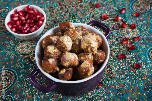 Juicy meat meatballs with dates and pomegranate seeds.