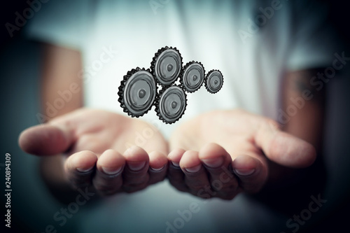 man holiding a technology gear wheel photo