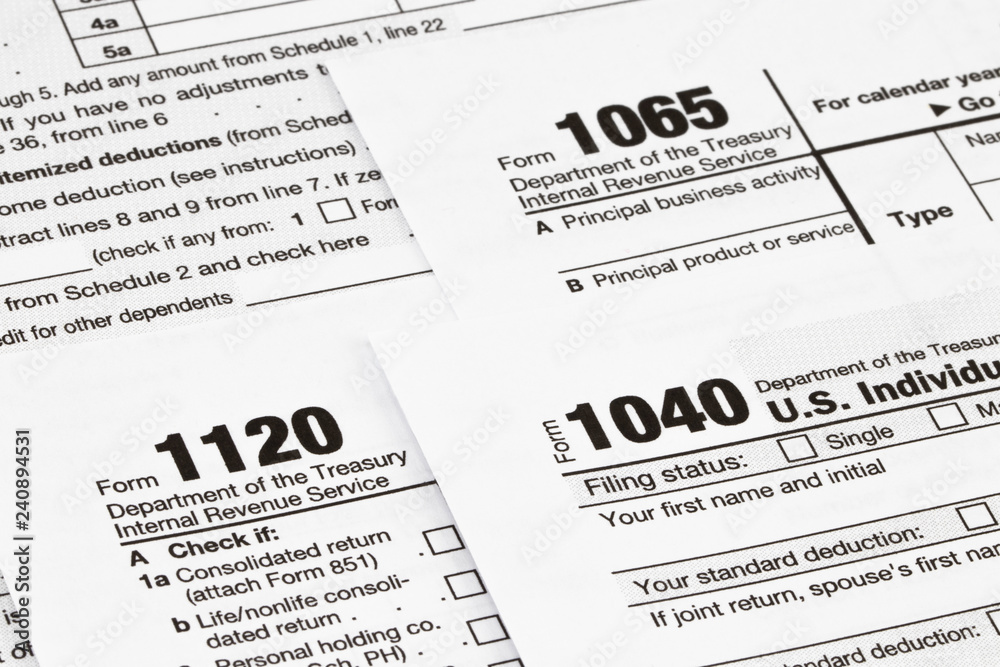 The tax forms with money and the pen. Tax Day concept The tax forms with money and the pen. Tax Day concept