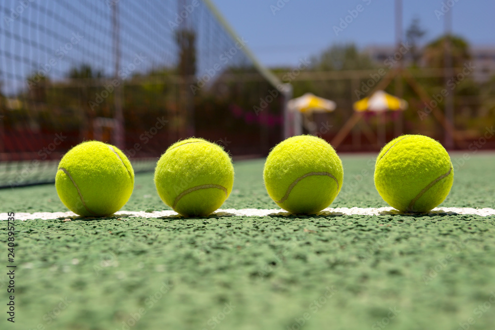 Tennis balls on a outdoor court