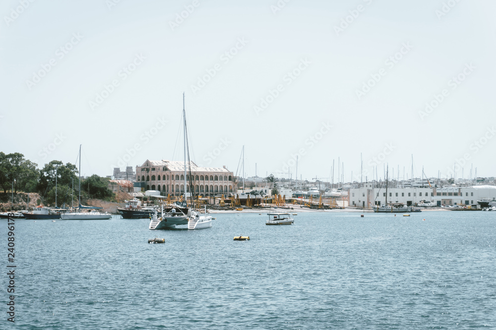 VALLETTA, MALTA - June 28, 2017: Typical Seaside port in Valletta in Malta VALLETTA, MALTA - June 28, 2017: Typical Seaside port in Valletta in Malta