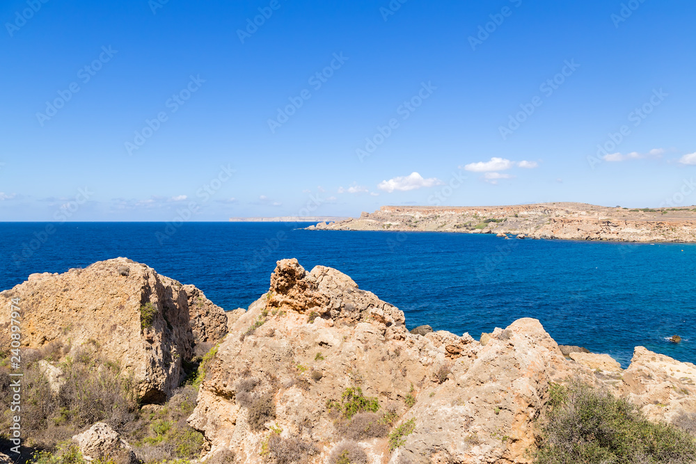Manikata, Malta. The rocky shores of Għajn Tuffieħa Bay