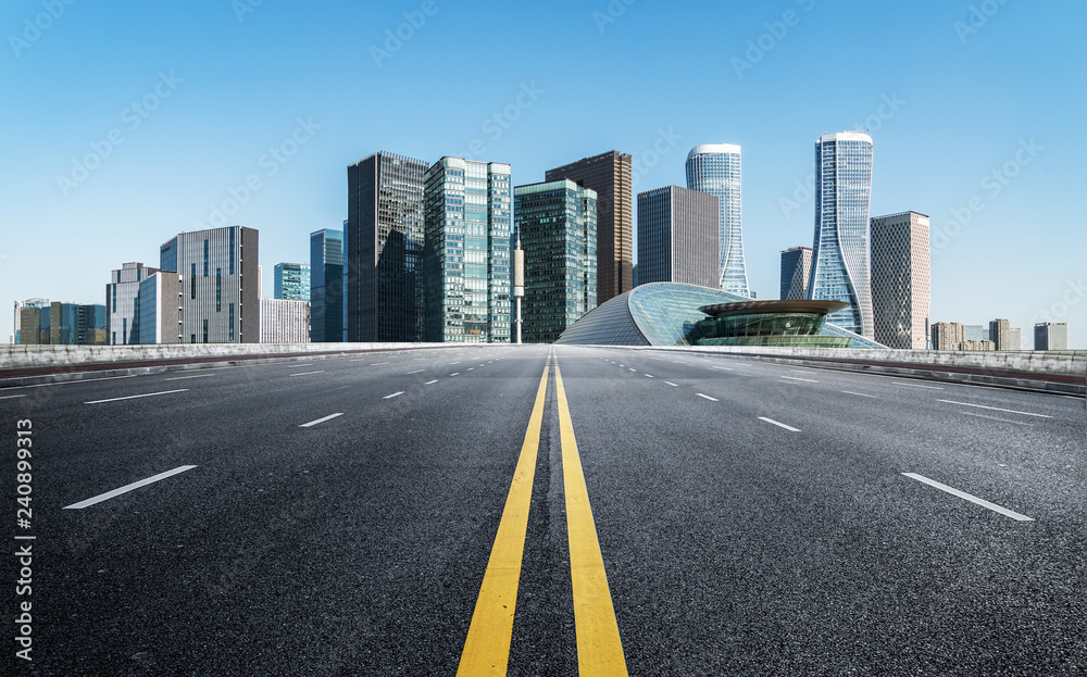 Empty road floor surface with modern city landmark buildings of hangzhou bund Skyline,zhejiang,china Empty road floor surface with modern city landmark buildings of hangzhou bund Skyline,zhejiang,china