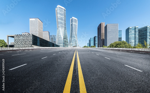 Empty road floor surface with modern city landmark buildings of hangzhou bund Skyline,zhejiang,china