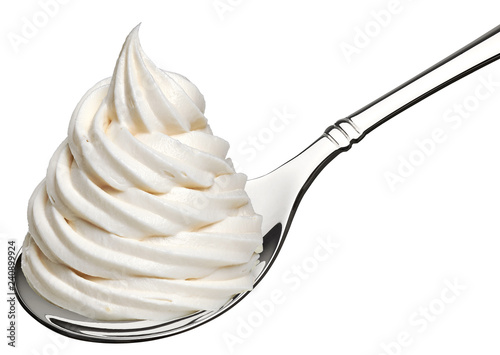 Whipped frozen yogurt or ice cream in spoon isolated on white background. photo