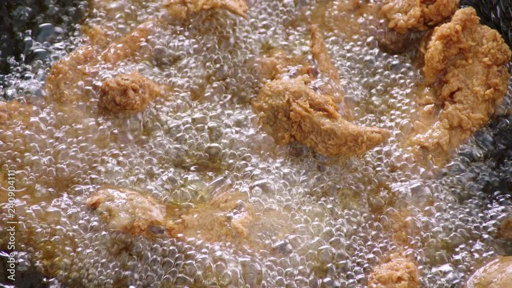 frying Chicken in boiling hot oil