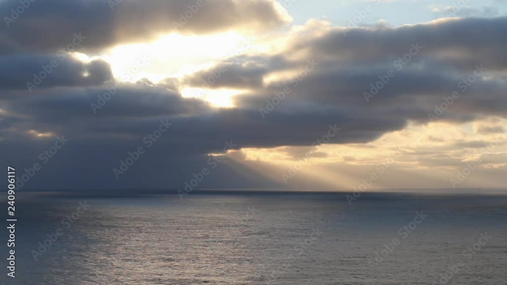 Sun breaking through the clouds at sunrise. Sun breaking through the clouds at sunrise.