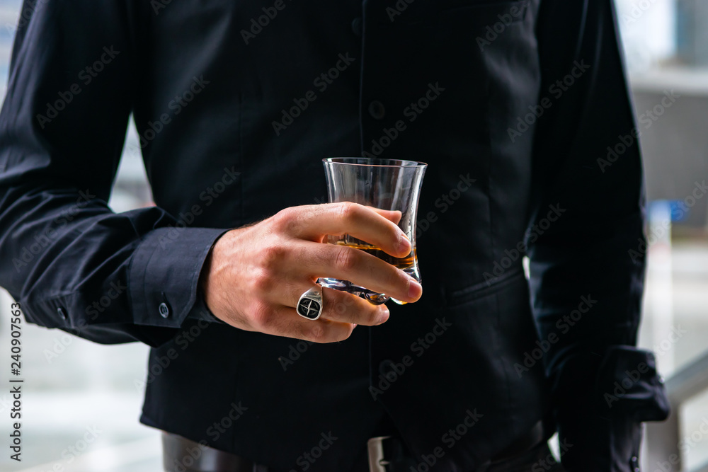 Man drinking a whiskey in Milan Man drinking a whiskey in Milan