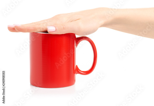 Red cup mug in female hand on white background isolation