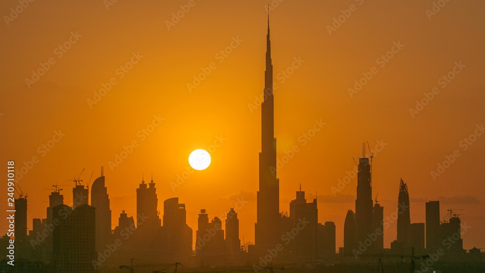 Sunset with skyline of Downtown Dubai in the evening timelapse.