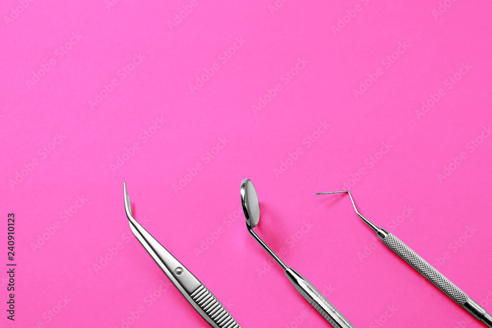 Dentist tools: mirror, dental probe and tweezers on pink gradient background. Dentist tools: mirror, dental probe and tweezers on pink gradient background.