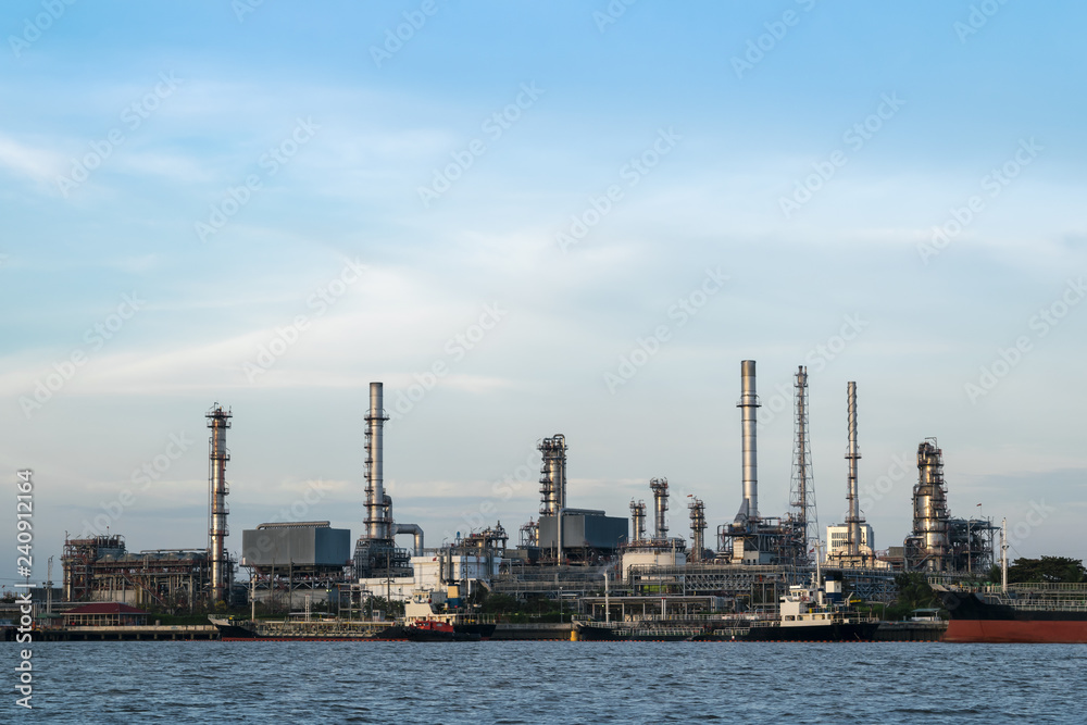 The oil refinery is located by the river. And ship transportation in bangkok Thailand