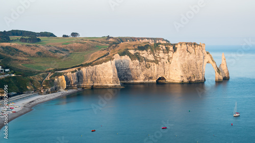 Chalk cliffs of Etretat with the natural arch Porte d'Aval and the stone needle called L'Aiguille