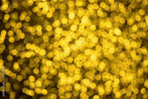 Blurred Christmas and New Year background with shiny gold stars