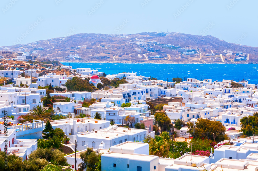 Whitewashed architecture and beautiful Aegean waters in Mykonos Island Whitewashed architecture and beautiful Aegean waters in Mykonos Island