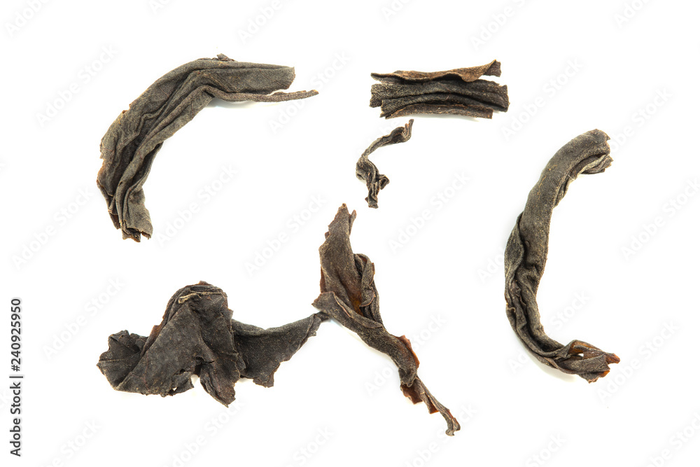 Dry black tea leaves isolated on white background Dry black tea leaves isolated on white background