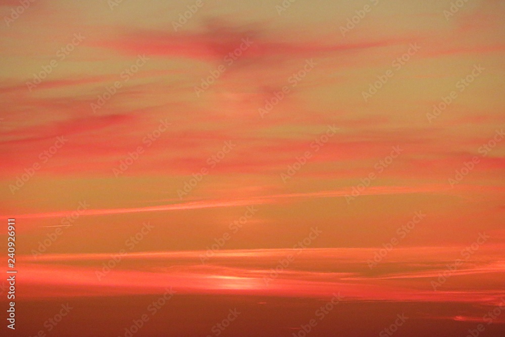 Beautiful fiery orange pink sunset in the sky, natural sunset background