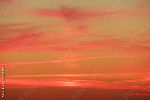 Beautiful fiery orange pink sunset in the sky, natural sunset background © natalya2015