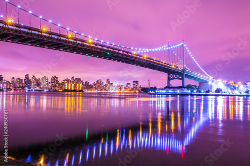 View of RFK Triborough Bridge from Astoria Queens towards Roosevelt Island and Manhattan New York City seen at night photo