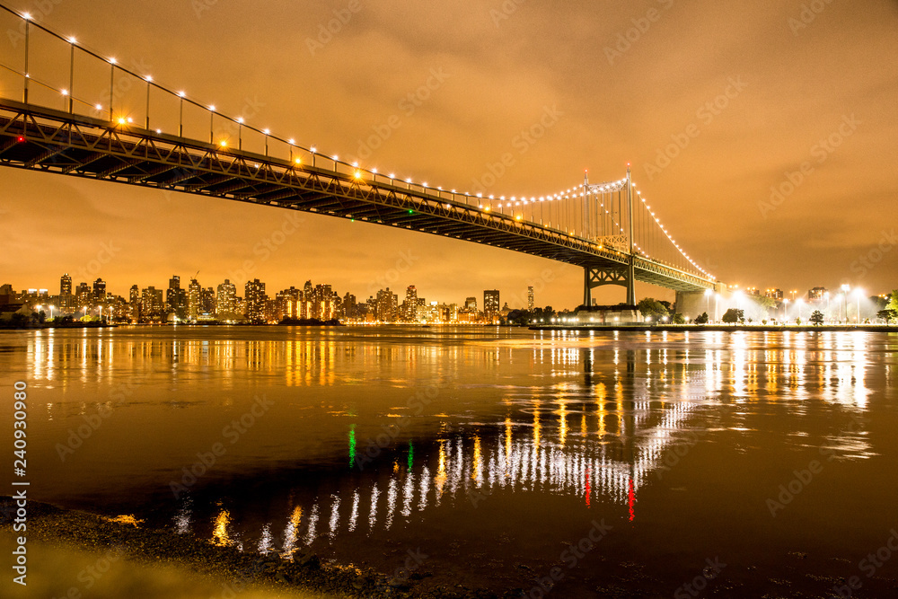 View of RFK Triborough Bridge from Astoria Queens towards Roosevelt Island and Manhattan New York City seen at night