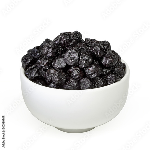 Sun dried blueberries heap or pile in bowl isolated on white background