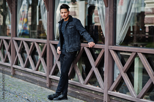 Handsome and fashionable indian man in black jeans jacket posed outdoor. © AS Photo Family