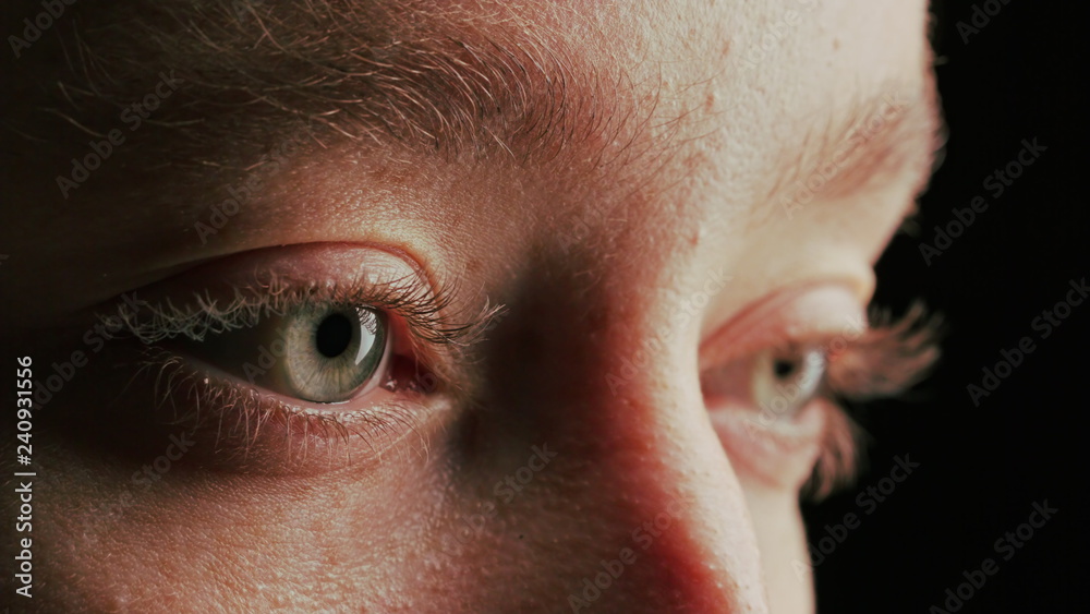 Fototapeta premium close up macro eye opening blinking light reflection on iris beauty