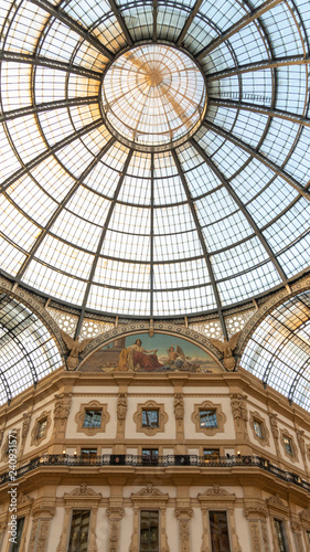 The cupola of Galleria Vittorio Emanuele from its center  with luxury decorations and the symmetric roof