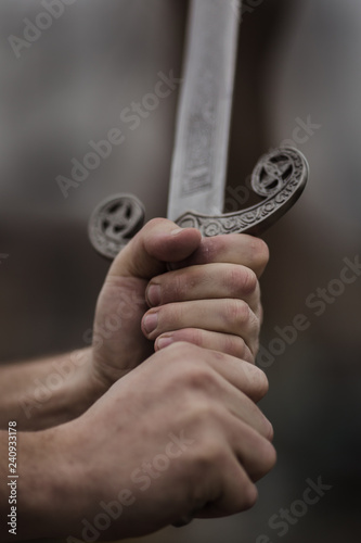 hands holding a sword photo