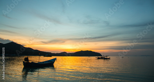 Fishermen boat at sunset near Koh Phangan island, Thailand