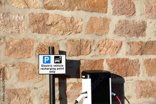 Fototapeta Naklejka Na Ścianę i Meble -  Electric charging point for vehicles cars bikes free no charge operated in shopping mall retail park in car parking space