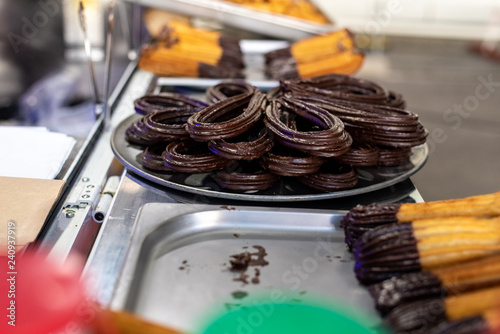 Typical Spanish churros bathed in chocolate.