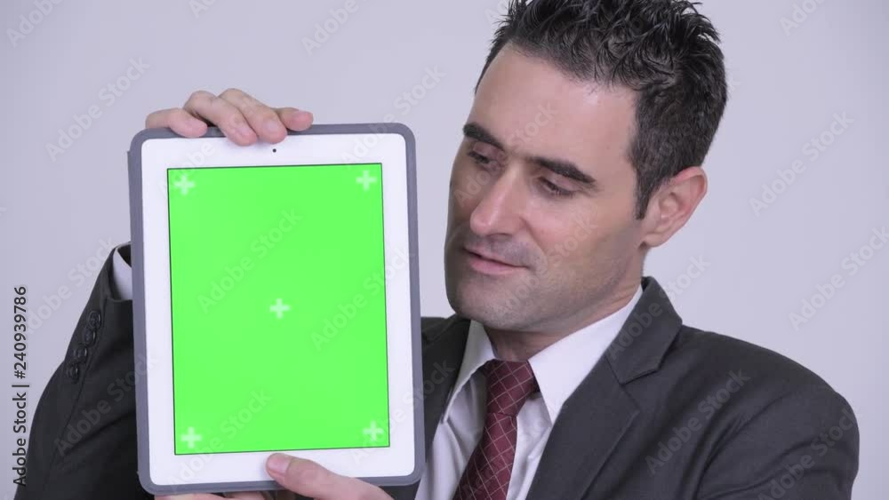 Face of happy handsome businessman showing digital tablet Face of happy handsome businessman showing digital tablet