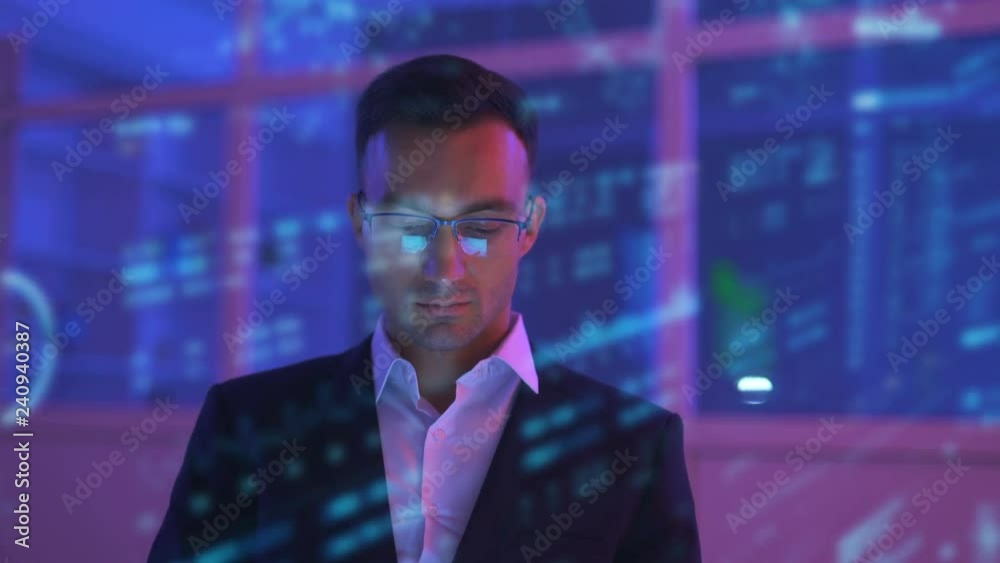 The businessman working in the dark room on the hologram background