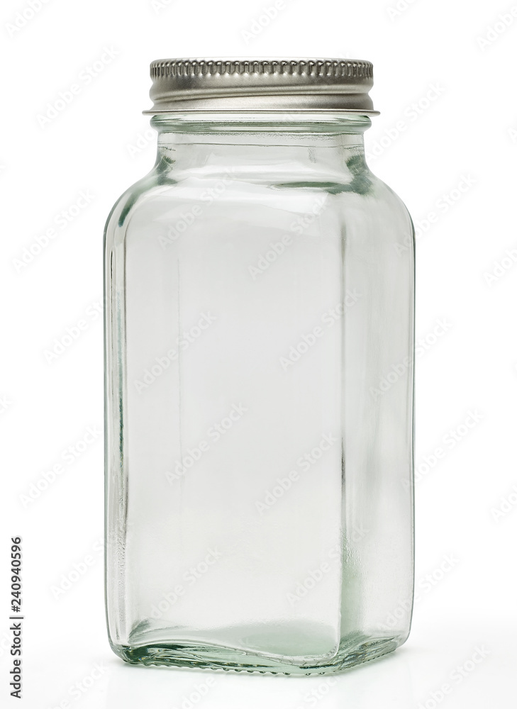 Clear empty glass canister or jar with silver cap isolated on white background with clipping path Clear empty glass canister or jar with silver cap isolated on white background with clipping path