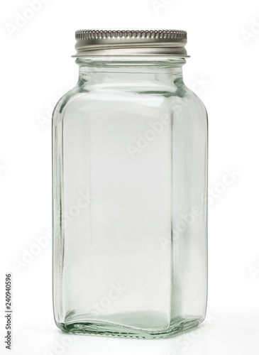 Clear empty glass canister or jar with silver cap isolated on white background with clipping path