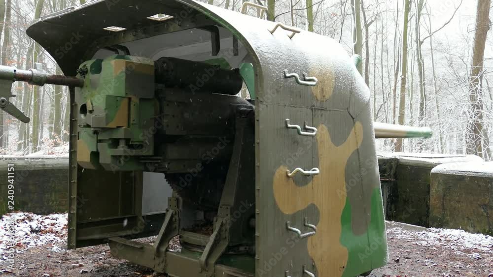 Rotating Artillery Cannon in Winter Forest During Snowfall Rotating Artillery Cannon in Winter Forest During Snowfall
