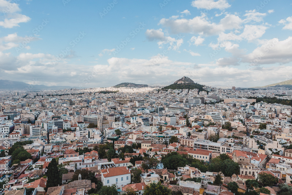 Panoramic view over the old town of Athens and the Parthenon Temple of the Acropolis during sunset