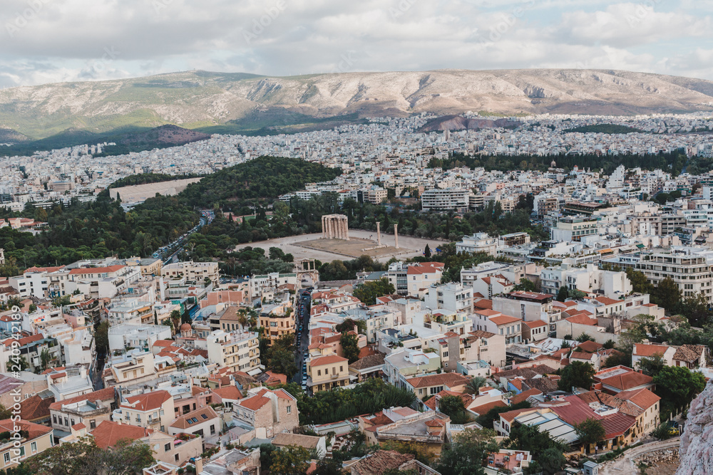 Panoramic view over the old town of Athens and the Parthenon Temple of the Acropolis during sunset