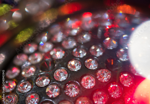 Close-up view of jewelry with colorful light