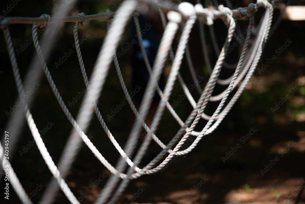 A rope bridge at a backyard low ropes course