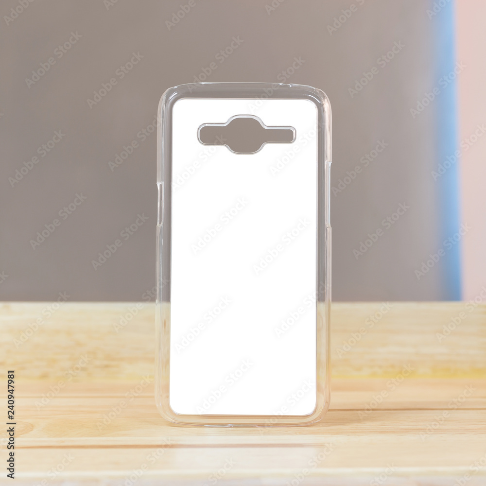 Clear mobile case on wood background in modern room. Protection smartphone object for your design. Clear mobile case on wood background in modern room. Protection smartphone object for your design.