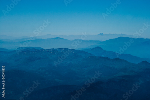 Fototapeta Naklejka Na Ścianę i Meble -  Mountain aerial view. houses and fields