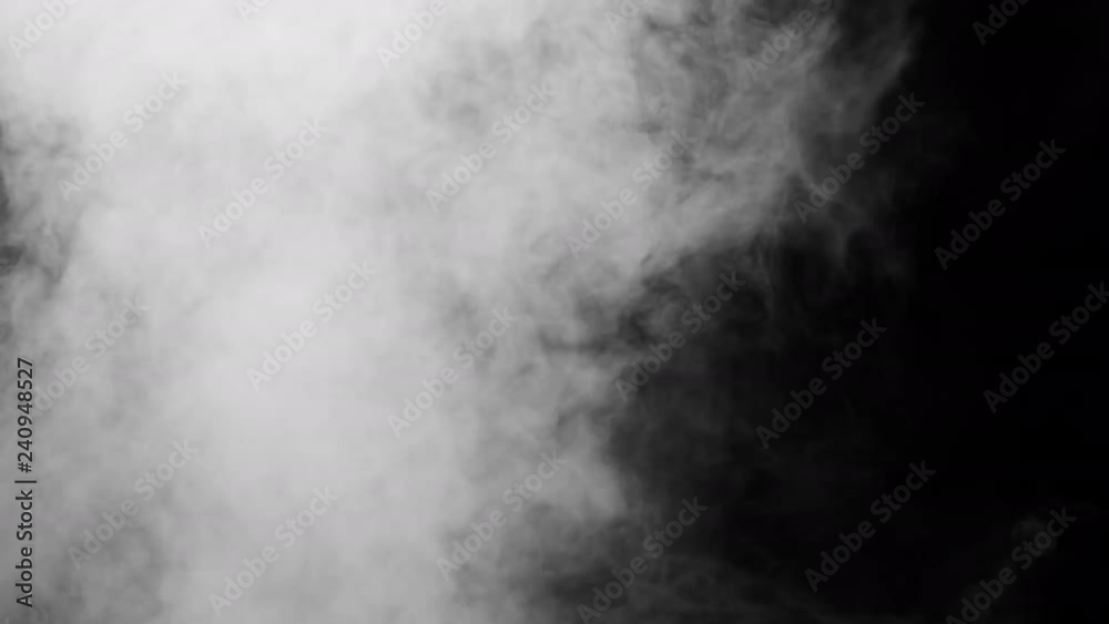 White clouds of vapor smoke are isolated on a black background. Gas explodes, swirl and dances in space. A magic fog dust texture effect that can be used by overlay and changing their transparency.