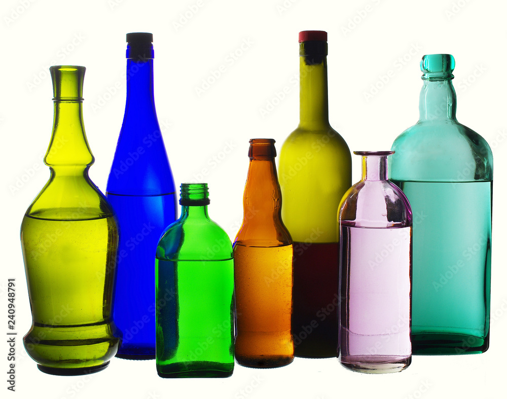 Colored wine bottles on white. Isolated on white Colored wine bottles on white. Isolated on white