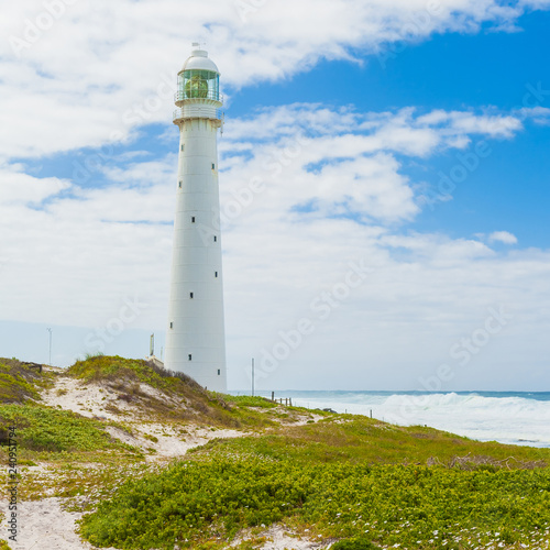 Lighthouse on a rugged coastline during the daytime