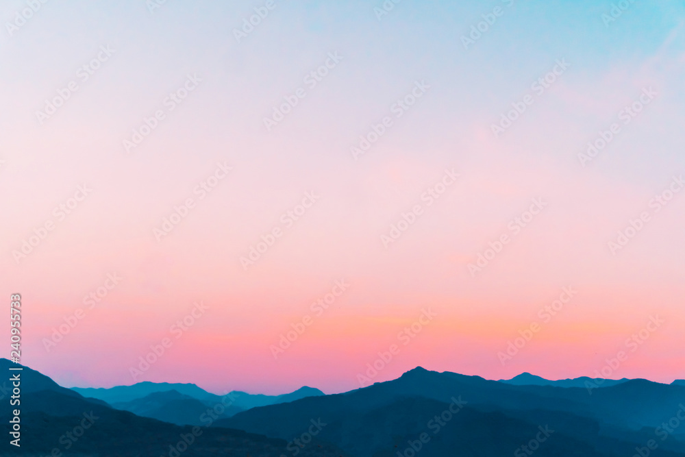 Mountain scenery view landscape with twilight sky beautiful magenta color tone theme sunset and sunrise background.