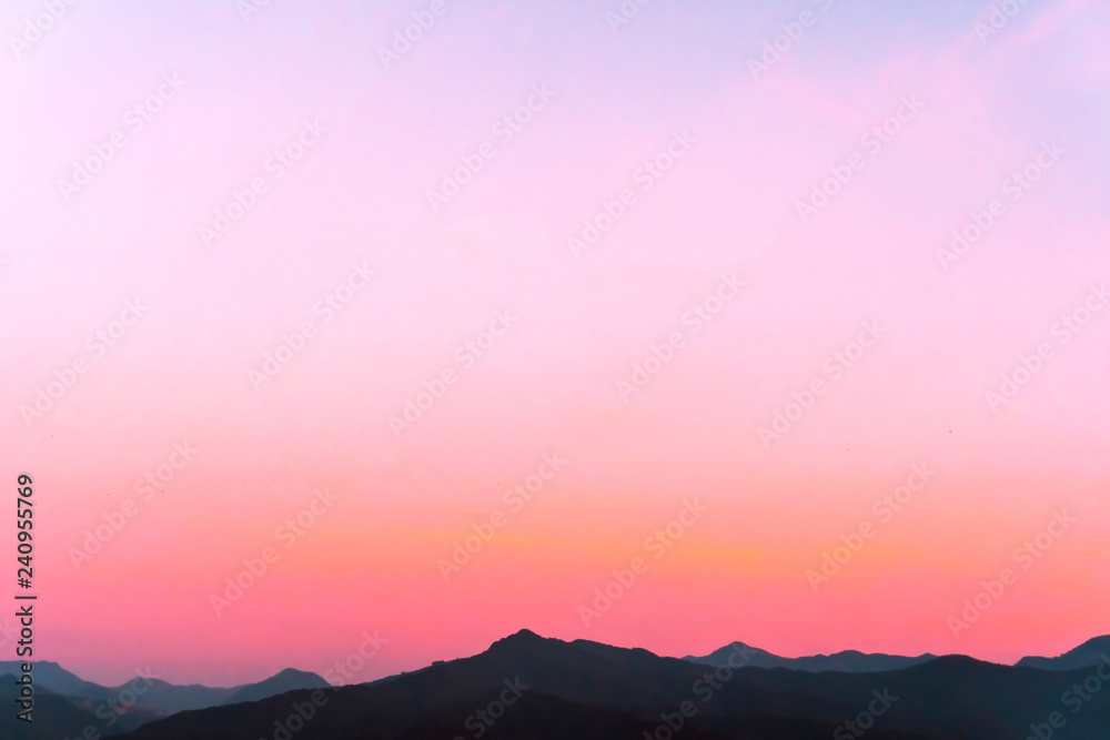 Mountain scenery view landscape with twilight sky beautiful magenta color tone theme sunset and sunrise background.