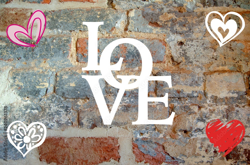 The word Love written out over a brick wall background