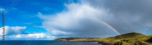 Rainbow above Duntulm Bay and the castle ruins on the Isle of Skye - Scotland photo